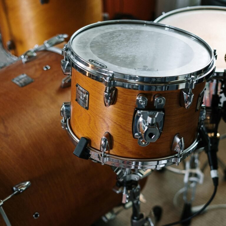 Close-up of a wooden drum set in a music studio, capturing musical detail.